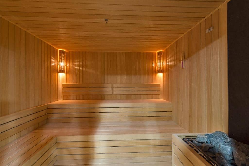 Hotel Boursier 1 & Spa - a sauna with wood paneling and lights on the wall at Hotel Boursier 1 &amp; Spa in Istanbul