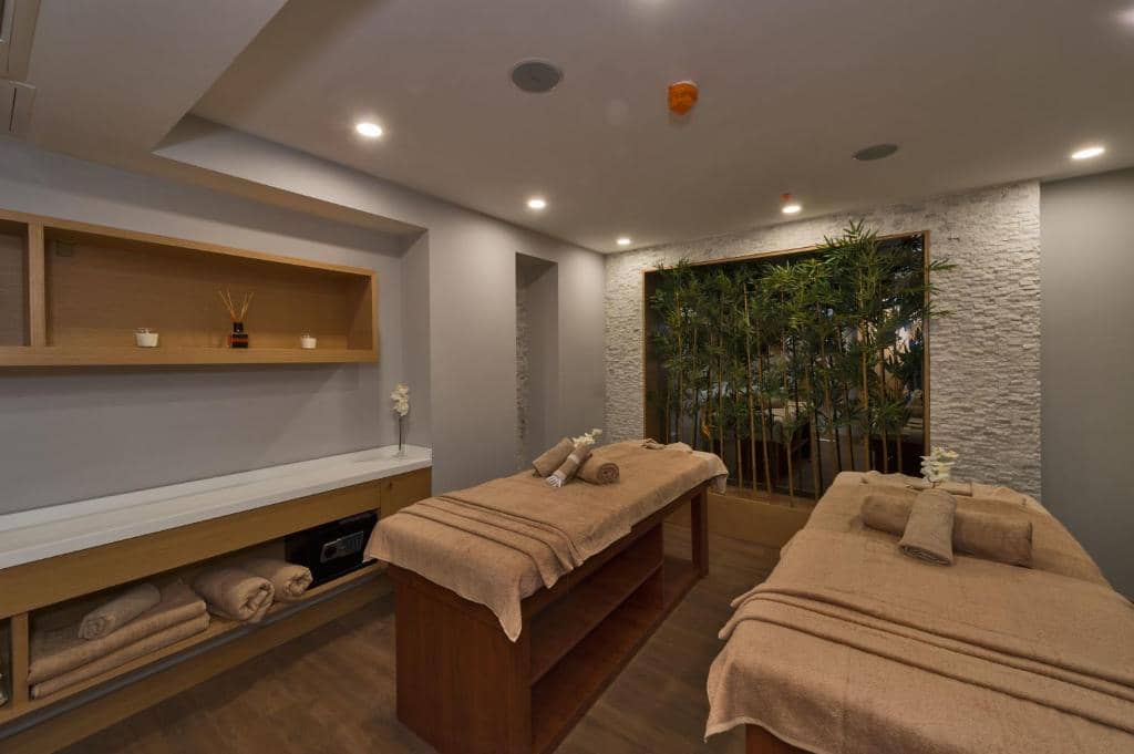 Hotel Boursier 1 & Spa - a massage room with two beds and a window at Hotel Boursier 1 &amp; Spa in Istanbul