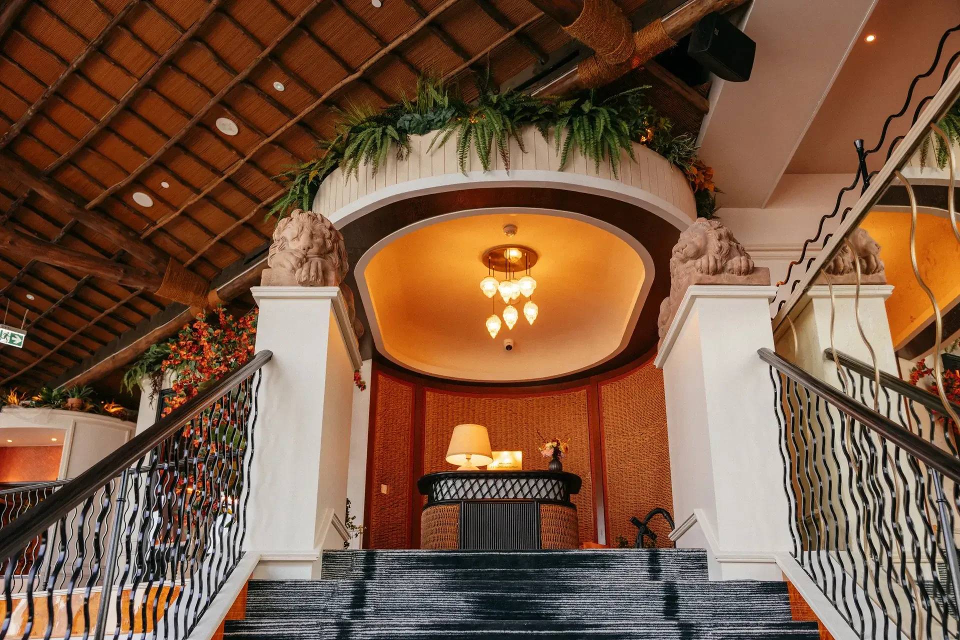 Elegant interior of Lion in the Sun Dubai with staircase and decor.