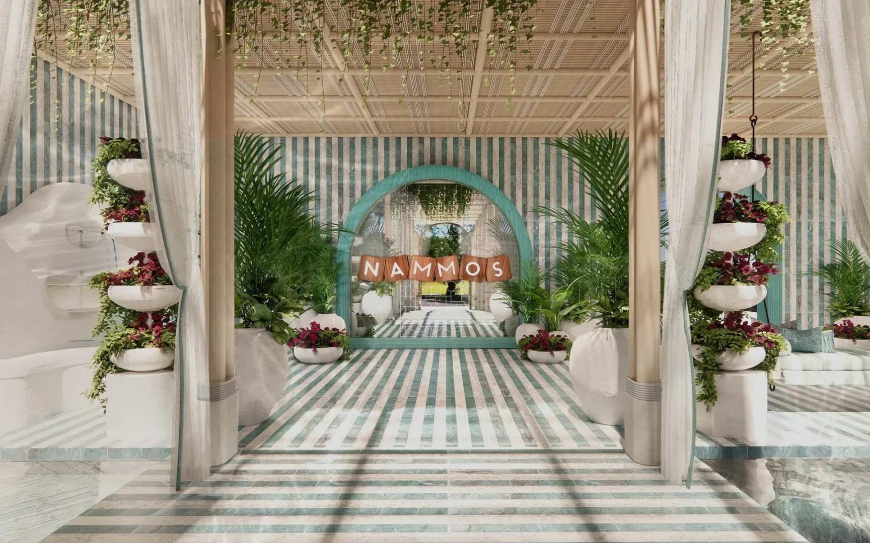 Elegant interior of Nammos Dubai with striped decor and plants.