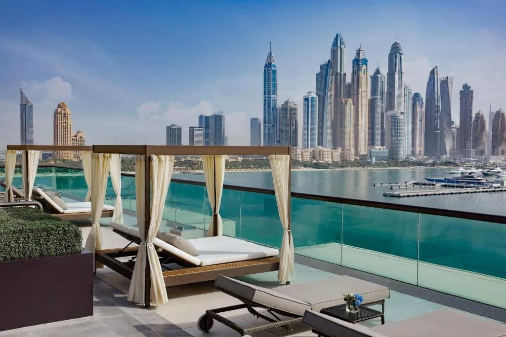 Hilton Dubai Palm Jumeirah terrace with city skyline view.