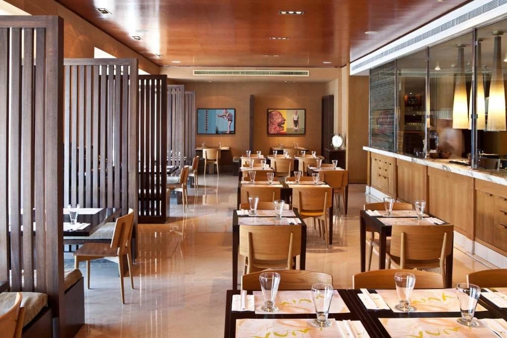 Contemporary dining space with wooden accents, Radisson Blu Hotel, Dubai.