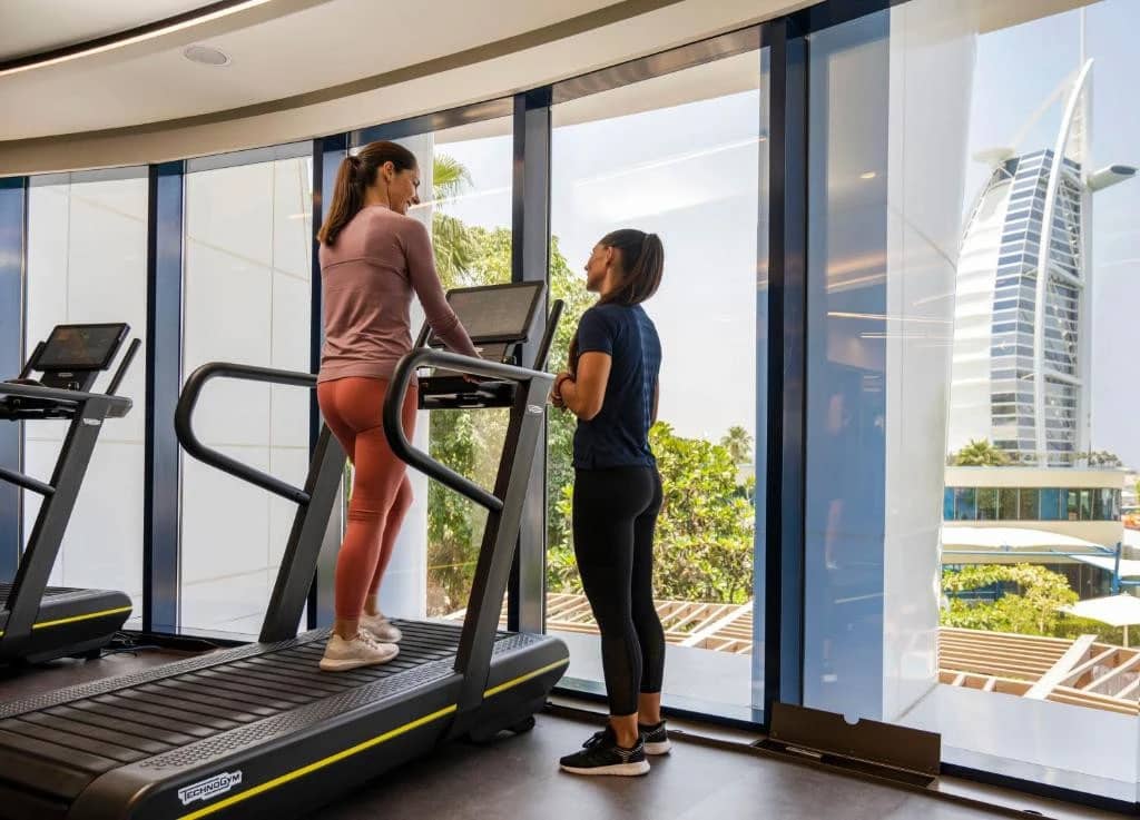 Gym with Burj Al Arab view at Jumeirah Beach Hotel, Dubai.