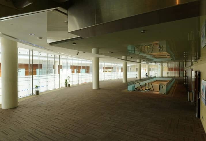 Spacious interior of Dubai World Trade Centre with glass walls.
