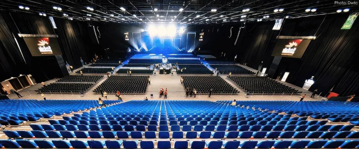 Spacious auditorium with blue seats at Dubai World Trade Centre.