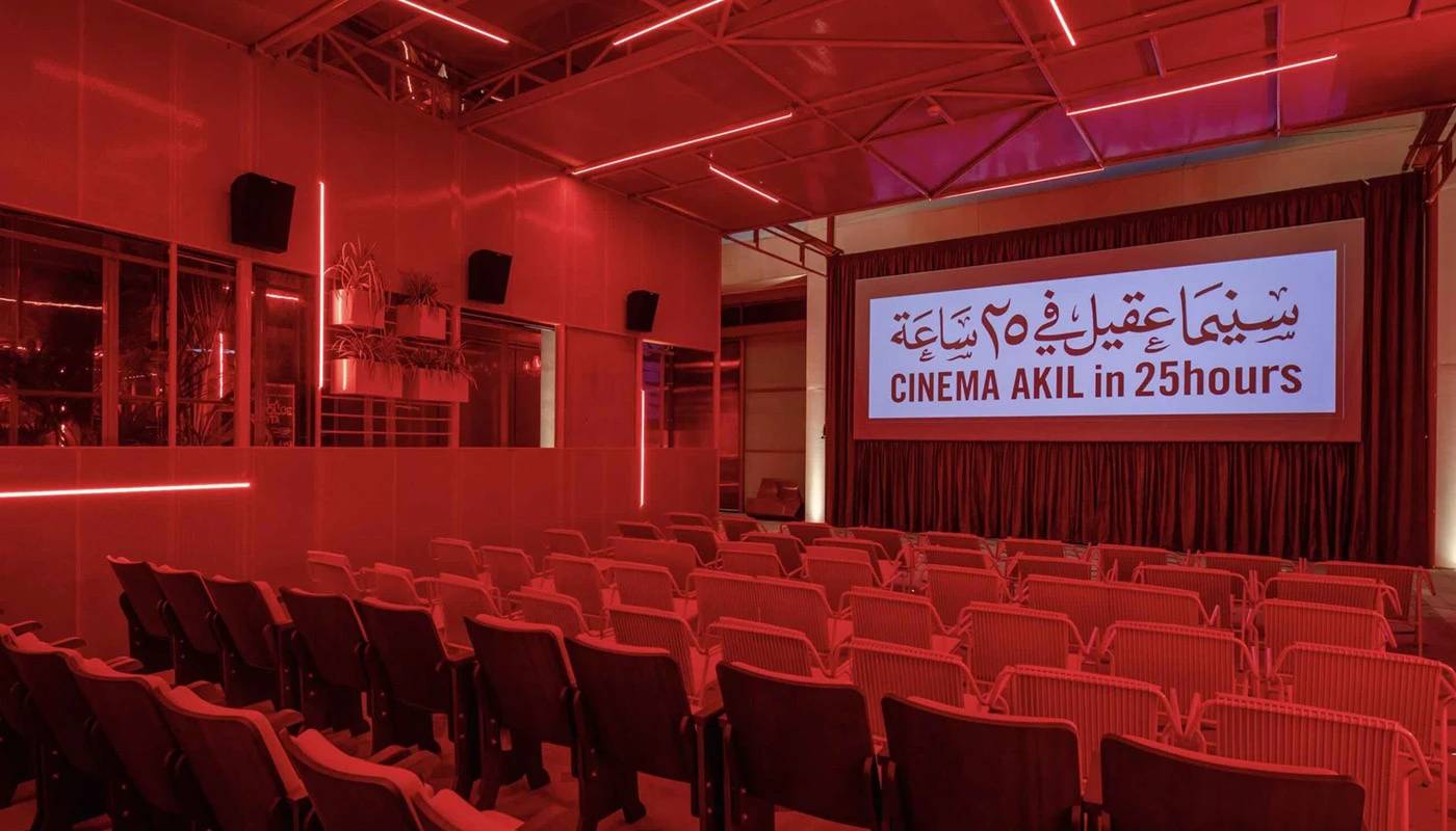 Cinema Akil auditorium with red lighting, Dubai.