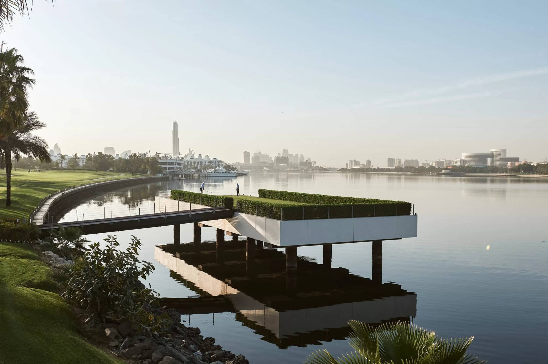 Dubai Creek Golf & Yacht Club overlooking serene water and cityscape.