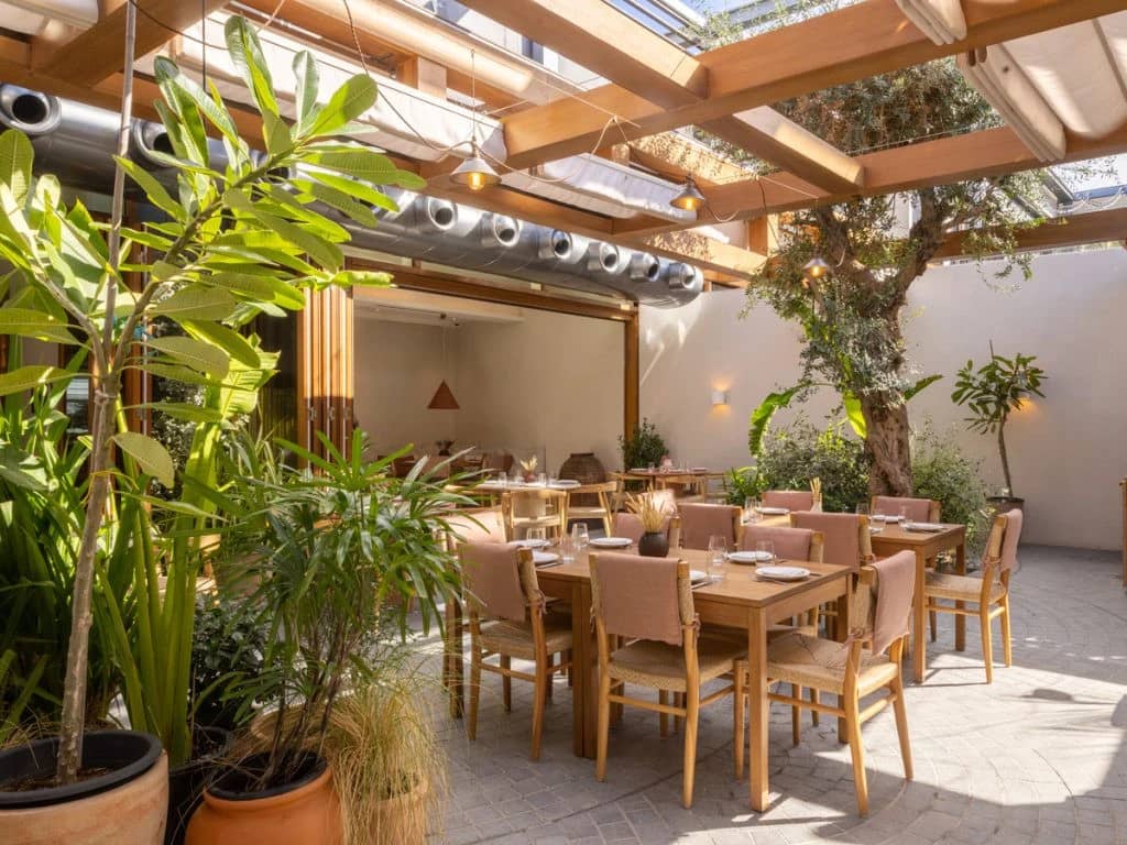 Outdoor dining area at Mythos Urban Greek Eatery, Dubai.