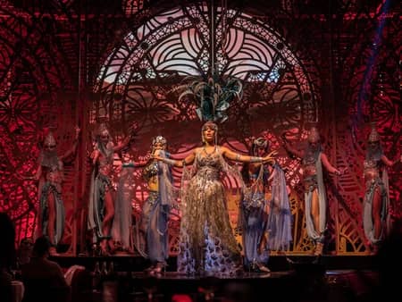 Performers in elaborate costumes on stage at Babylon Difc, Dubai.