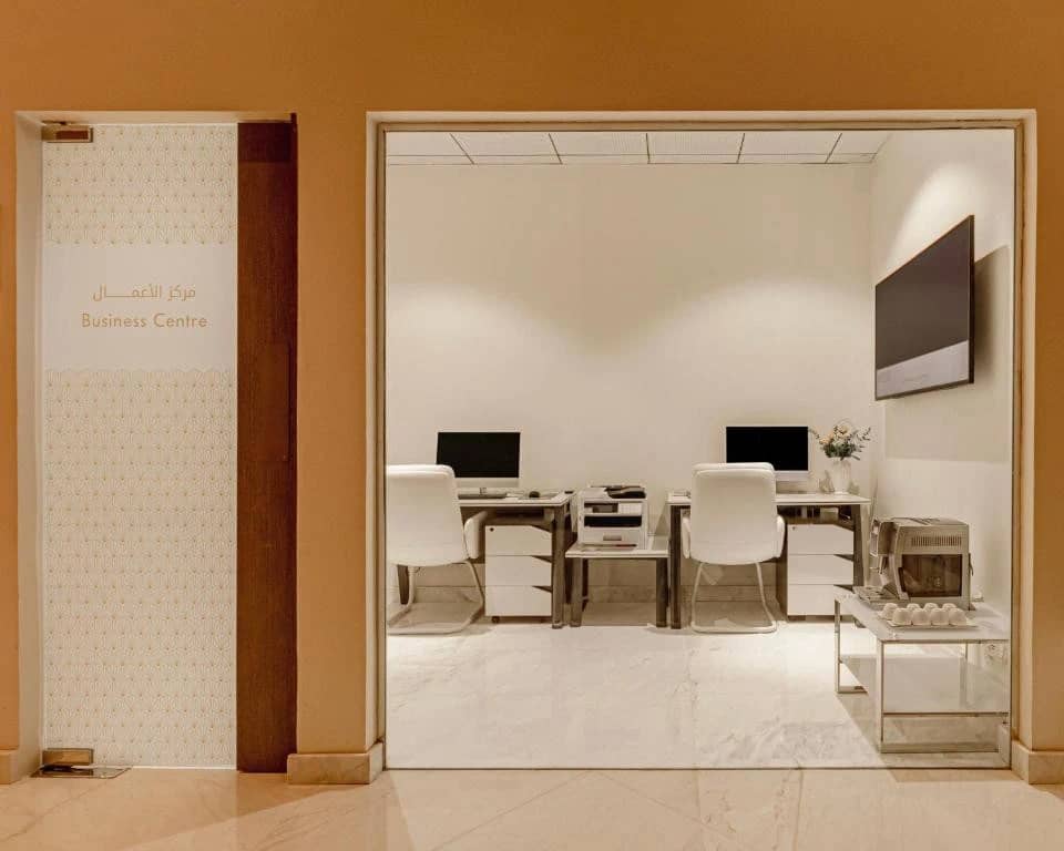 Khalidia Palace Hotel Dubai business center with computers and seating.