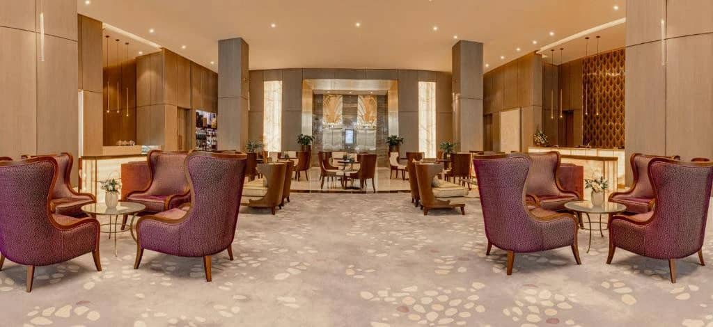 Elegant lounge area at Khalidia Palace Hotel Dubai with plush seating.
