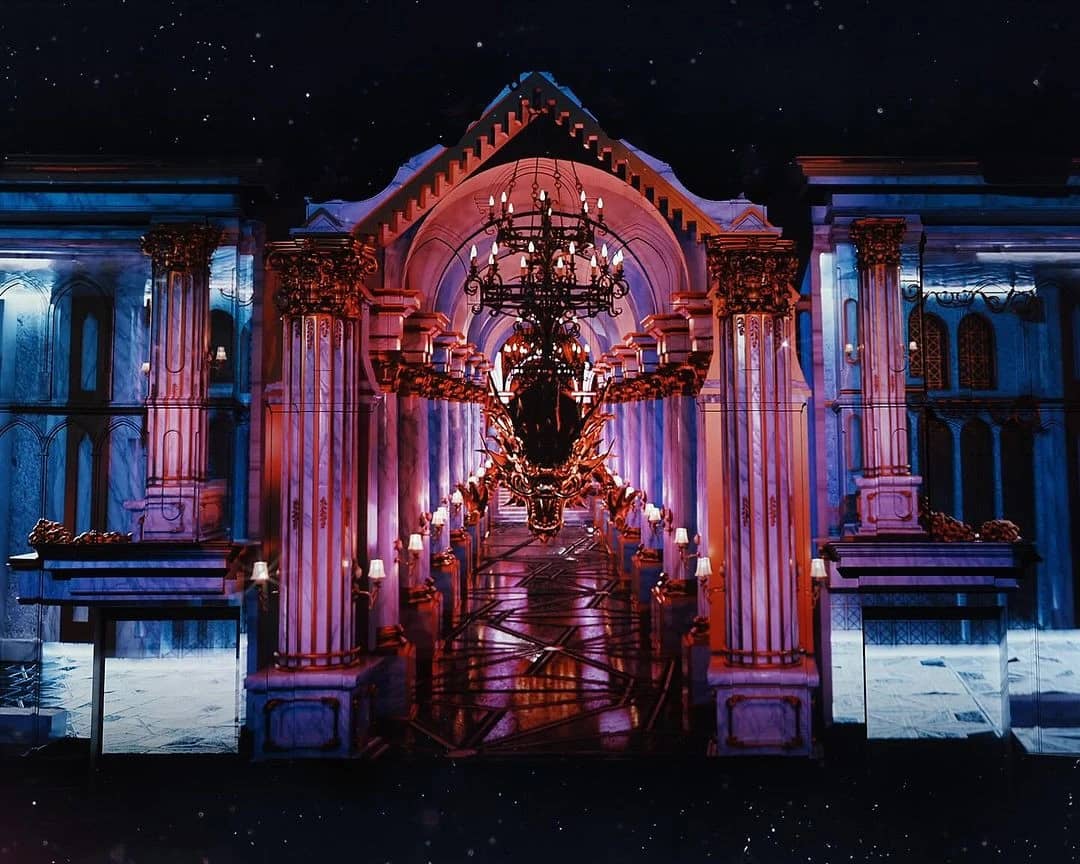 Lavish interior of DREAM Dubai Dinner Show venue, featuring ornate columns.