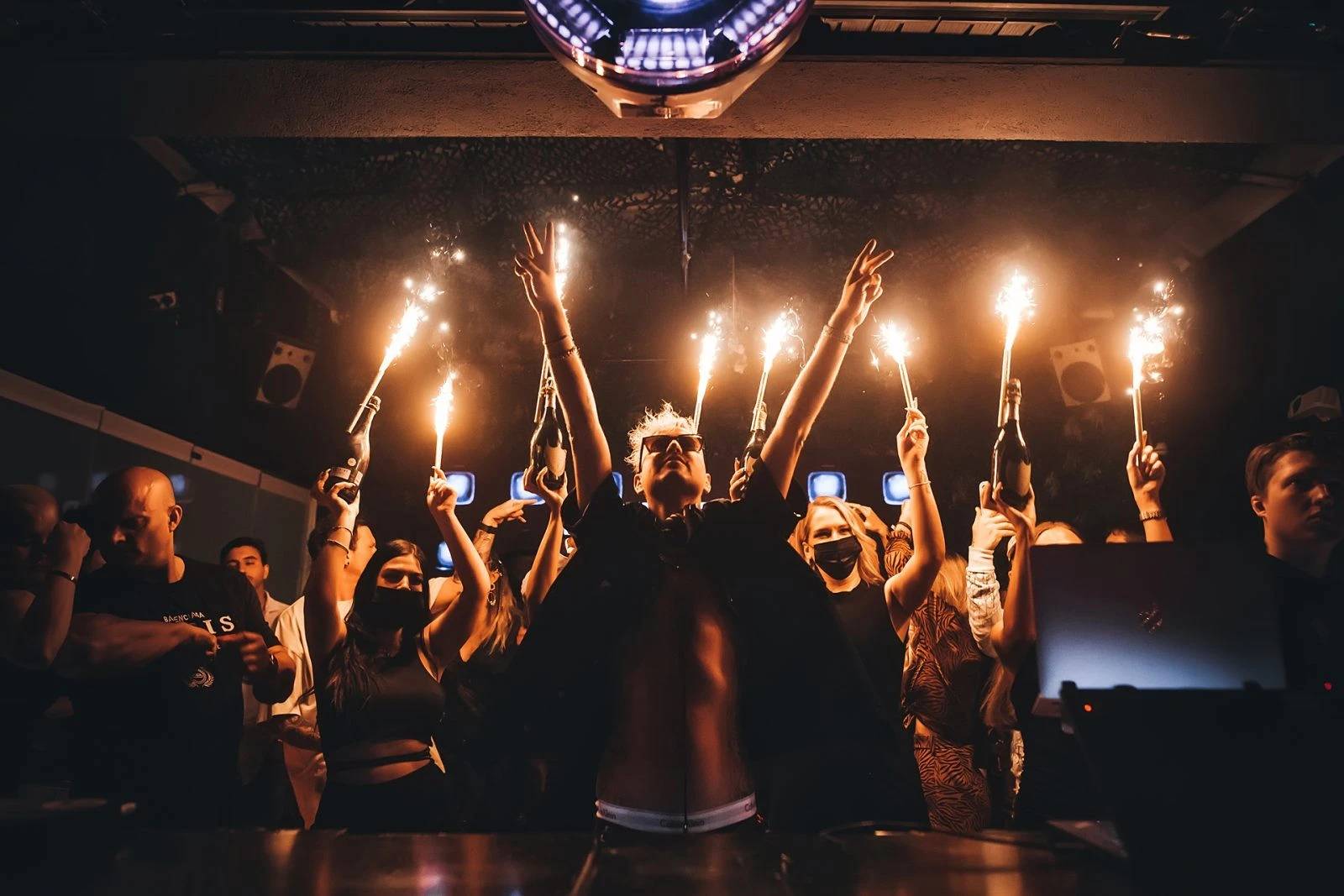 Celebration with sparklers at The Penthouse Dubai nightclub.