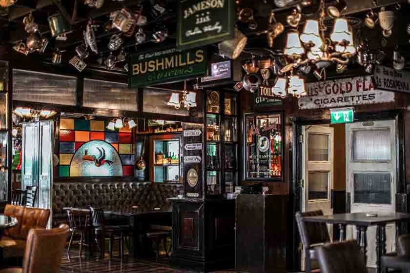 Stained glass and vintage decor inside McCafferty's Pub, Dubai.