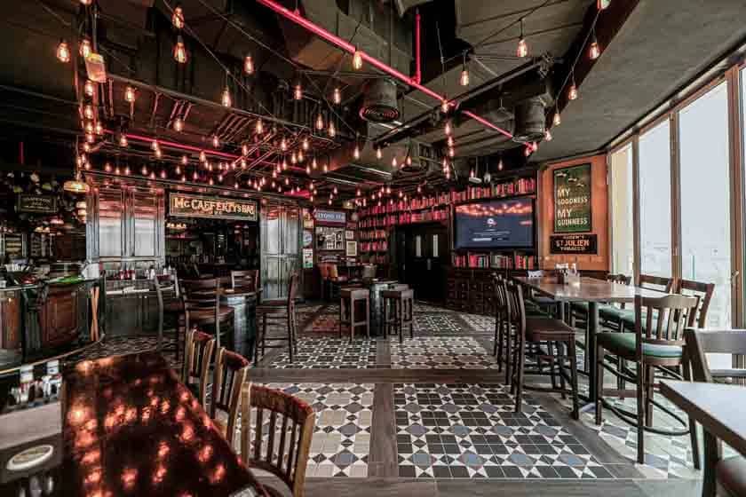 McCafferty's Pub interior, patterned floor tiles, pendant lights, Dubai.