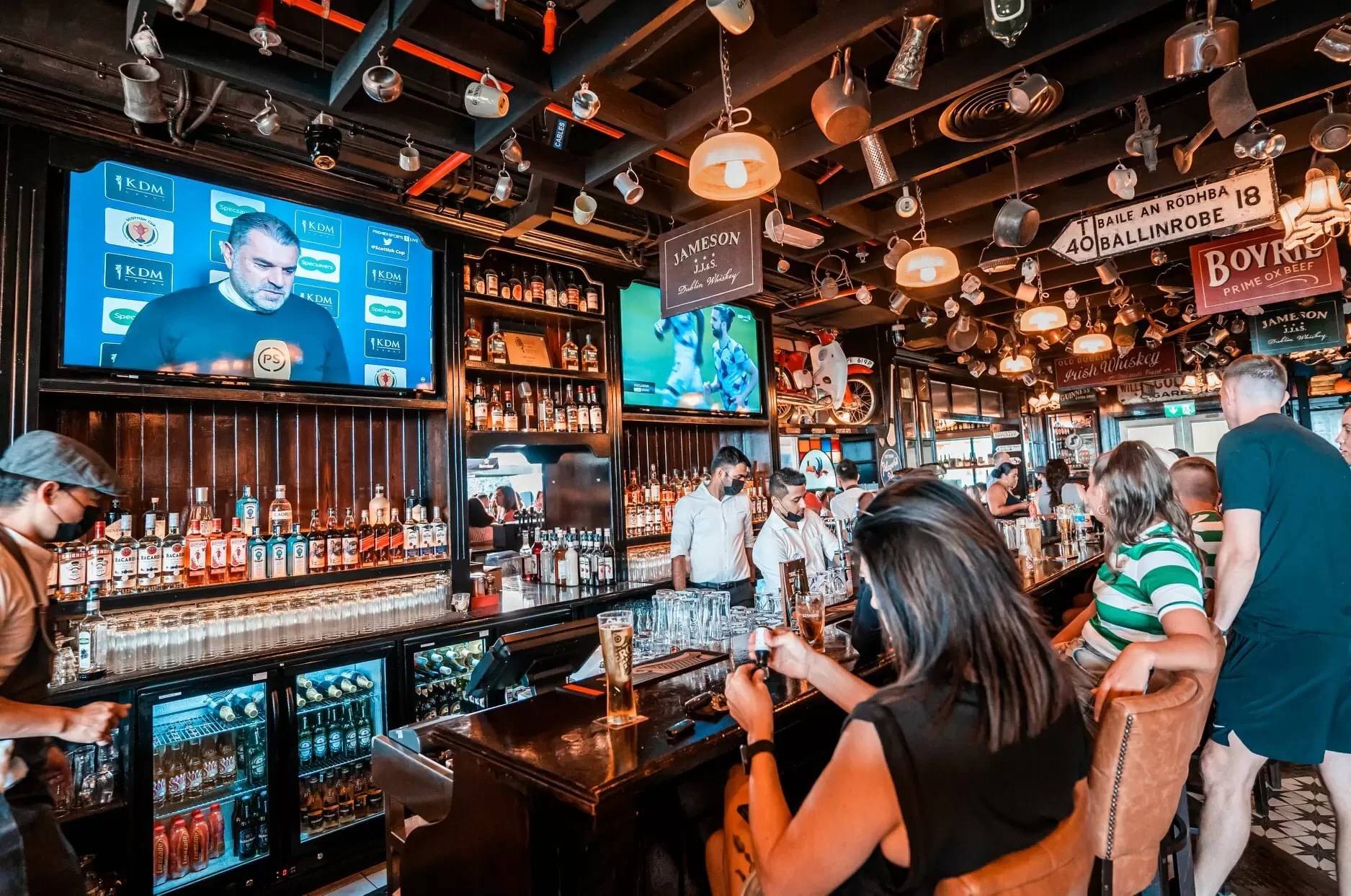 Busy bar scene at McCafferty's Pub Jumeirah Village, Dubai.