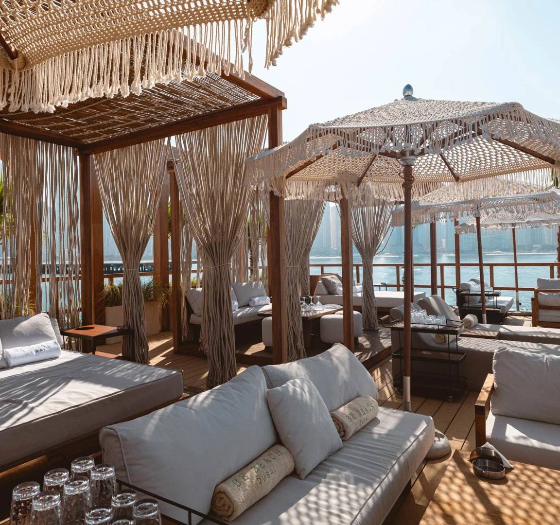Luxurious cabanas at Be Beach DXB overlooking Dubai waterfront.