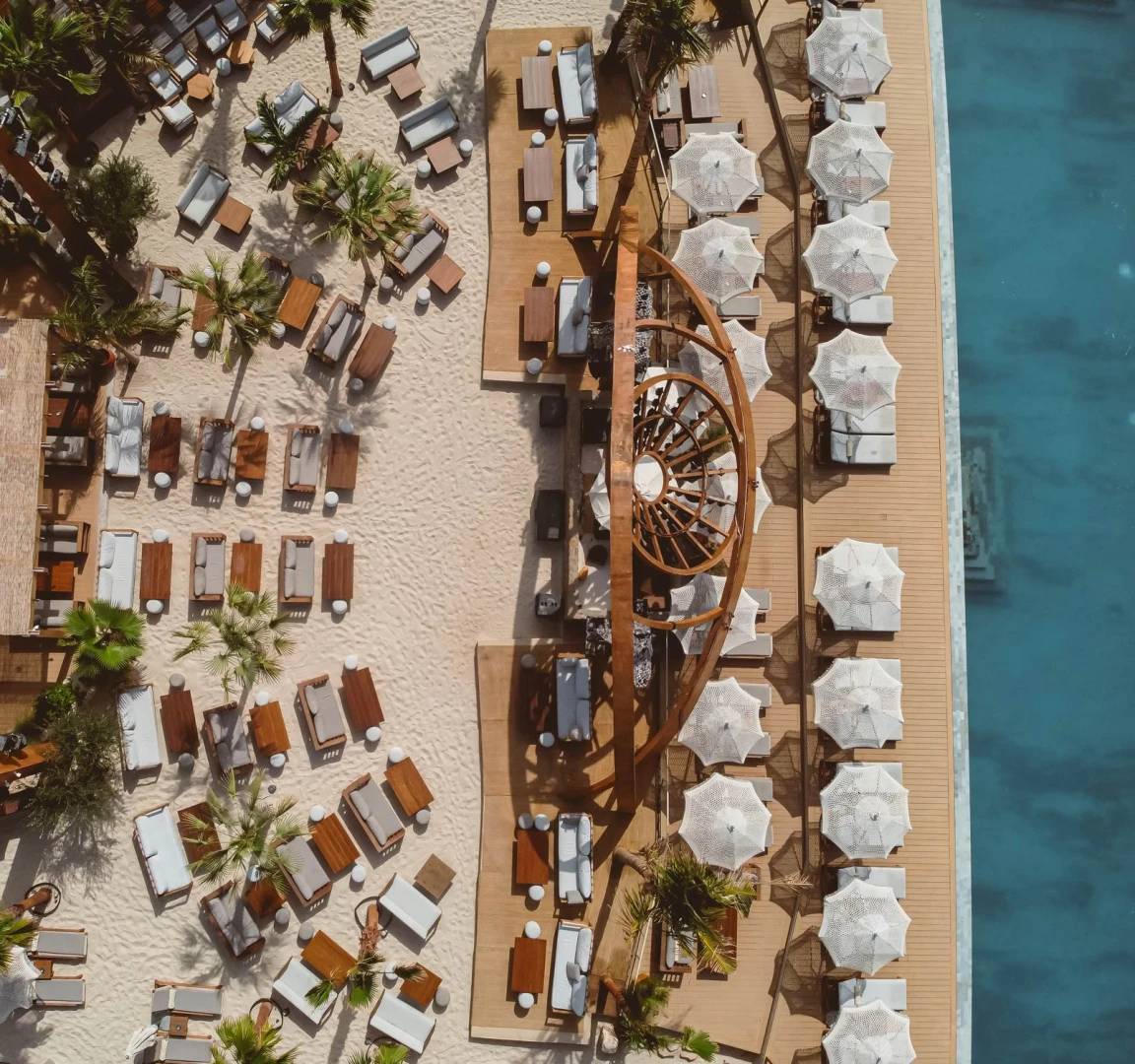 Aerial view of Be Beach DXB lounge with pool, Dubai.