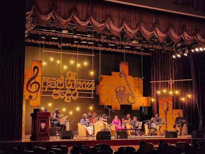 Musicians performing on stage at Sheikh Rashid Auditorium, Dubai.