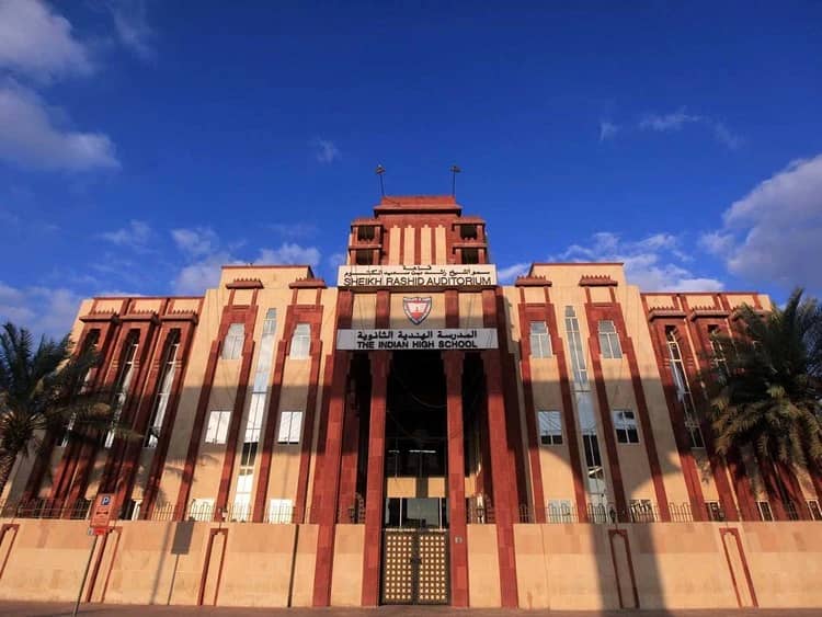 Sheikh Rashid Auditorium facade under blue sky, Dubai.