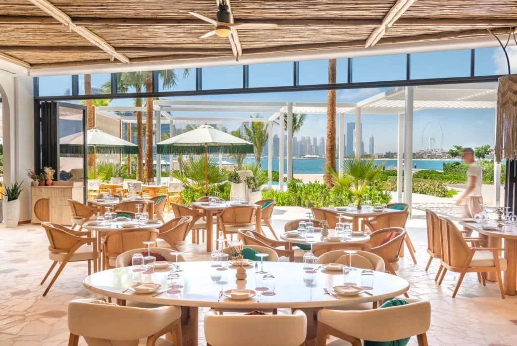 EVA Beach Restaurant in Dubai with ocean view and elegant seating.