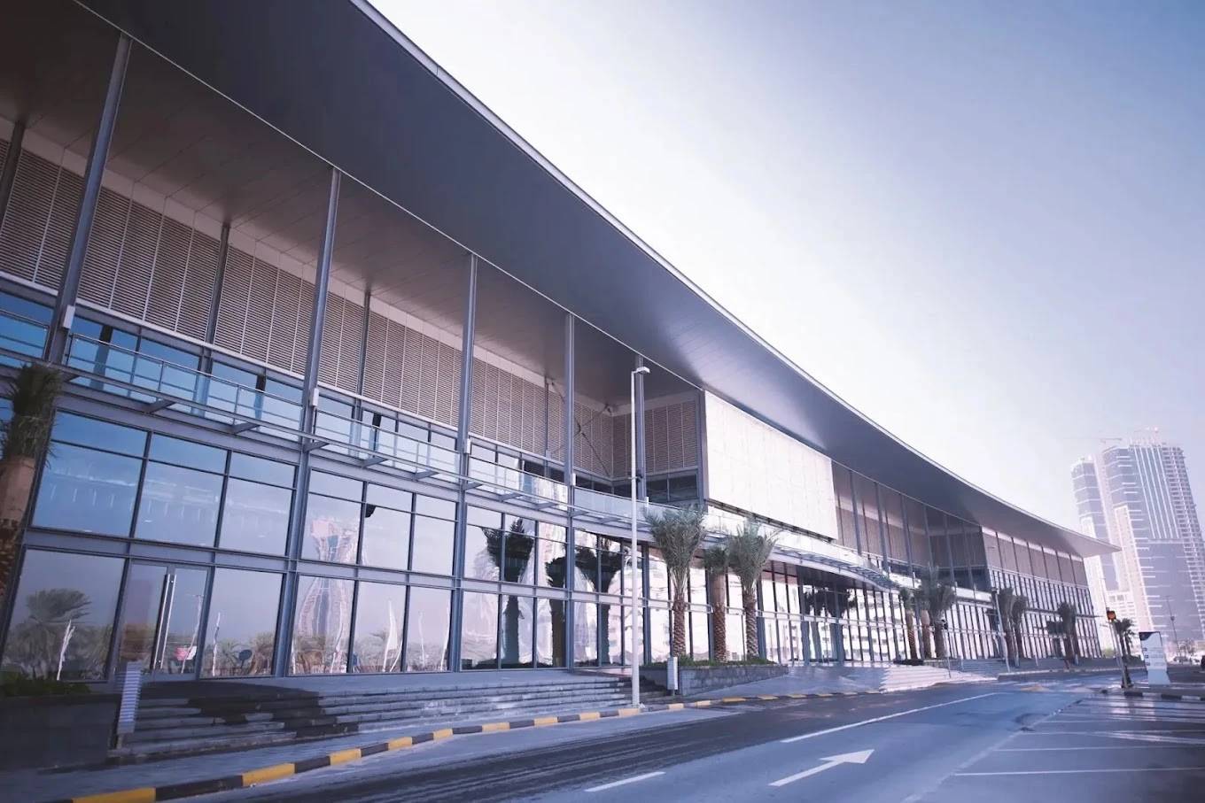 Modern exterior of Expo Centre Sharjah with glass facade.