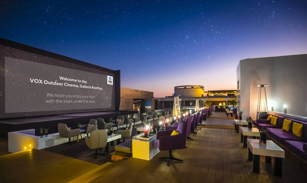 VOX Moonlight Dubai outdoor cinema with seating under starry sky.