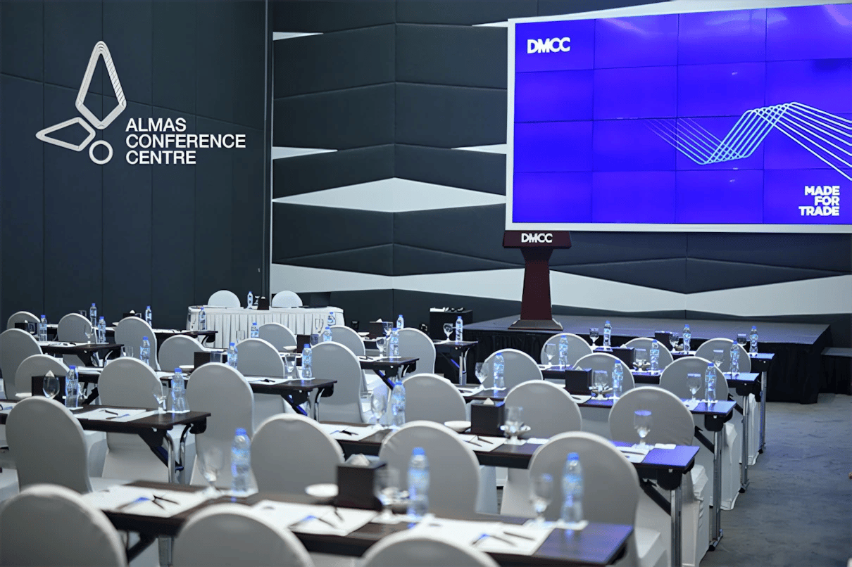 Almas Conference Centre auditorium setup with chairs and tables, Dubai.