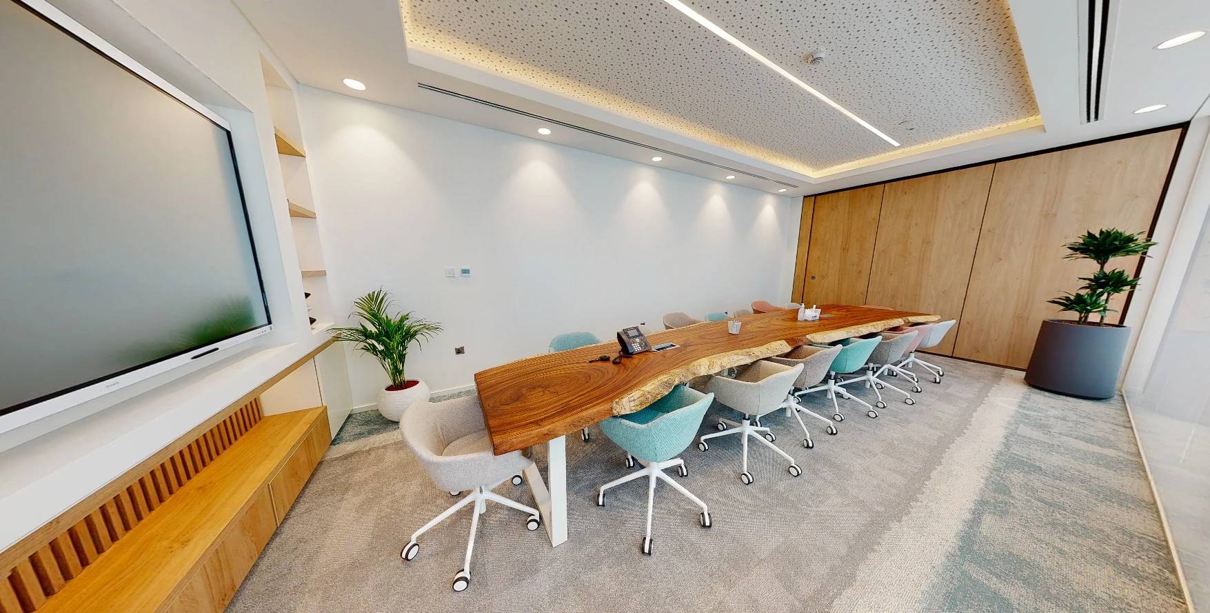Spacious meeting room with large screen, Cloud Spaces Circle Mall Dubai.