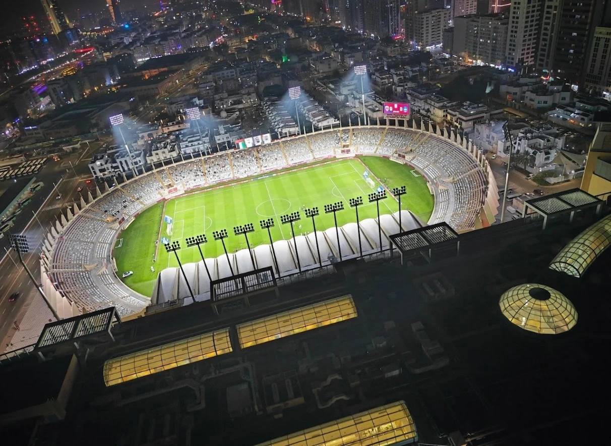 Aerial view of Al Nahyan Stadium in Abu Dhabi at night.