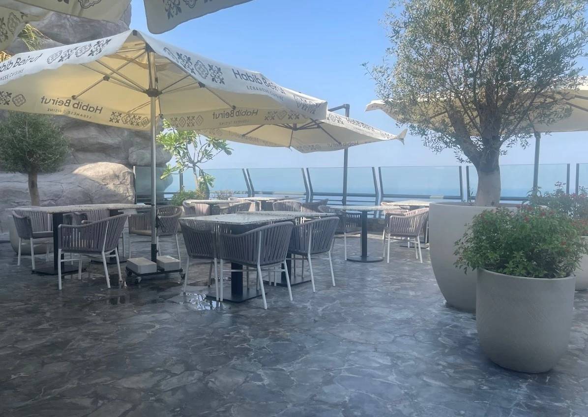 Outdoor seating at Habib Beirut Restaurant, Khorfakkan, overlooking the sea.