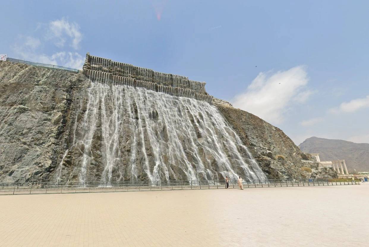 Khorfakkan waterfall near Habib Beirut Restaurant, Sharjah, under clear sky.