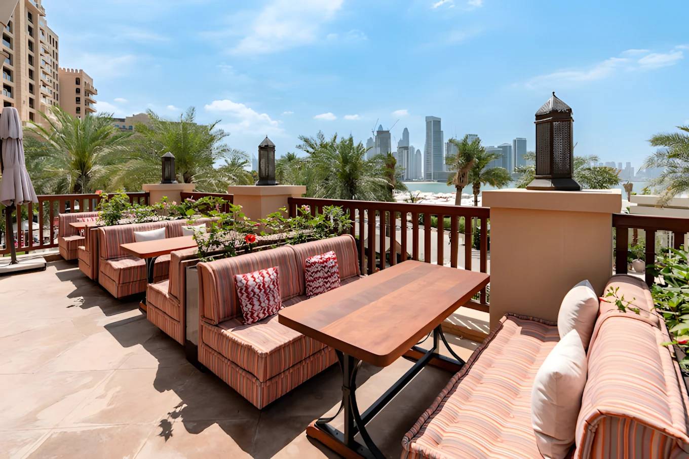 Outdoor seating at Grand Zor Restaurant Dubai with city skyline view.