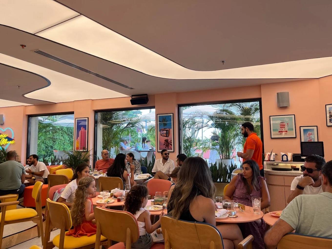 Peaches & Cream Beach Restaurant Dubai, lively indoor dining scene.