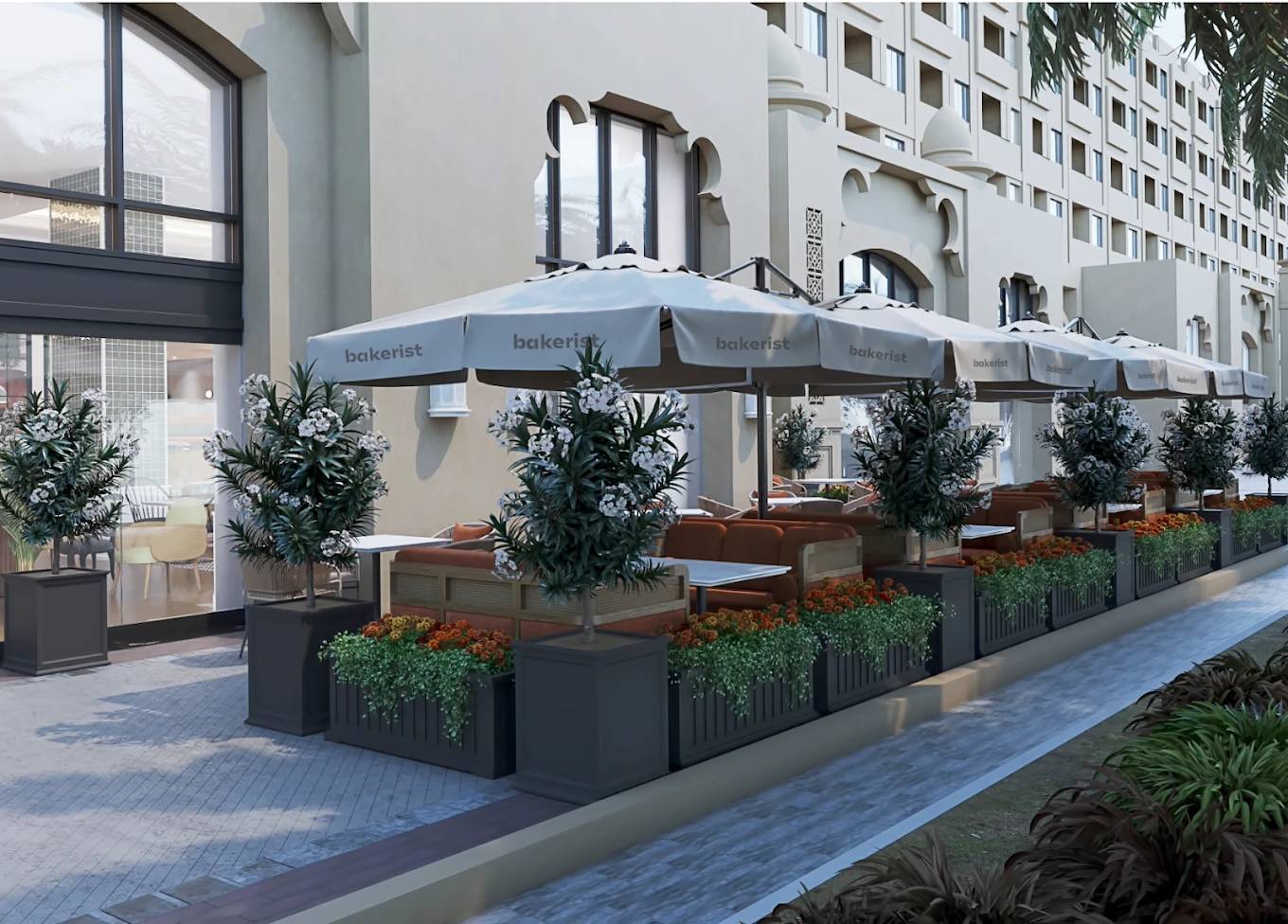 Outdoor seating at Bakerist The Palm Jumeirah, Dubai with umbrellas.