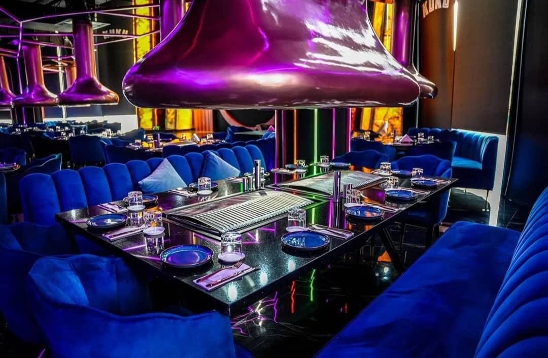 Vibrant dining setup at KUKU Restaurant and Lounge, Dubai.
