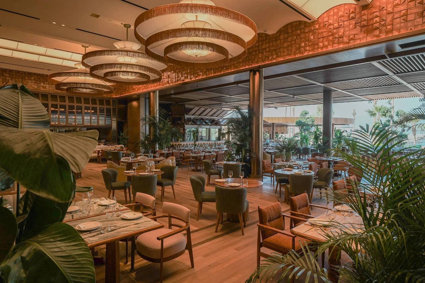 Elegant dining area at Baoli Restaurant Dubai with lush decor.