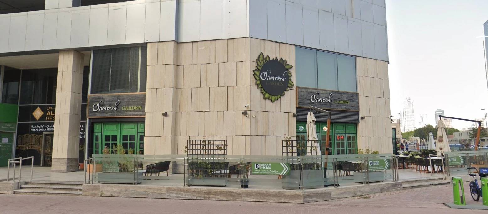 Charcoal Garden Restaurant entrance, Dubai Media City, outdoor seating visible.