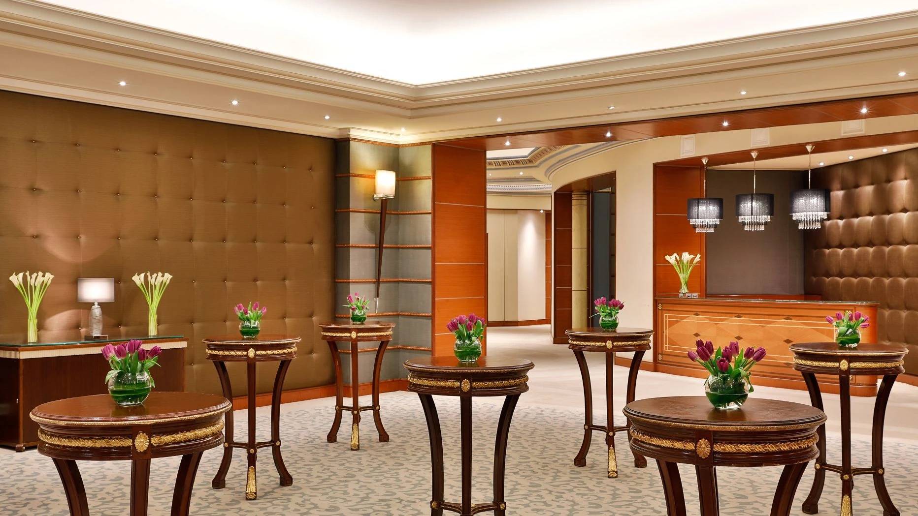 Elegant lobby with floral arrangements, The Ritz Carlton Riyadh.