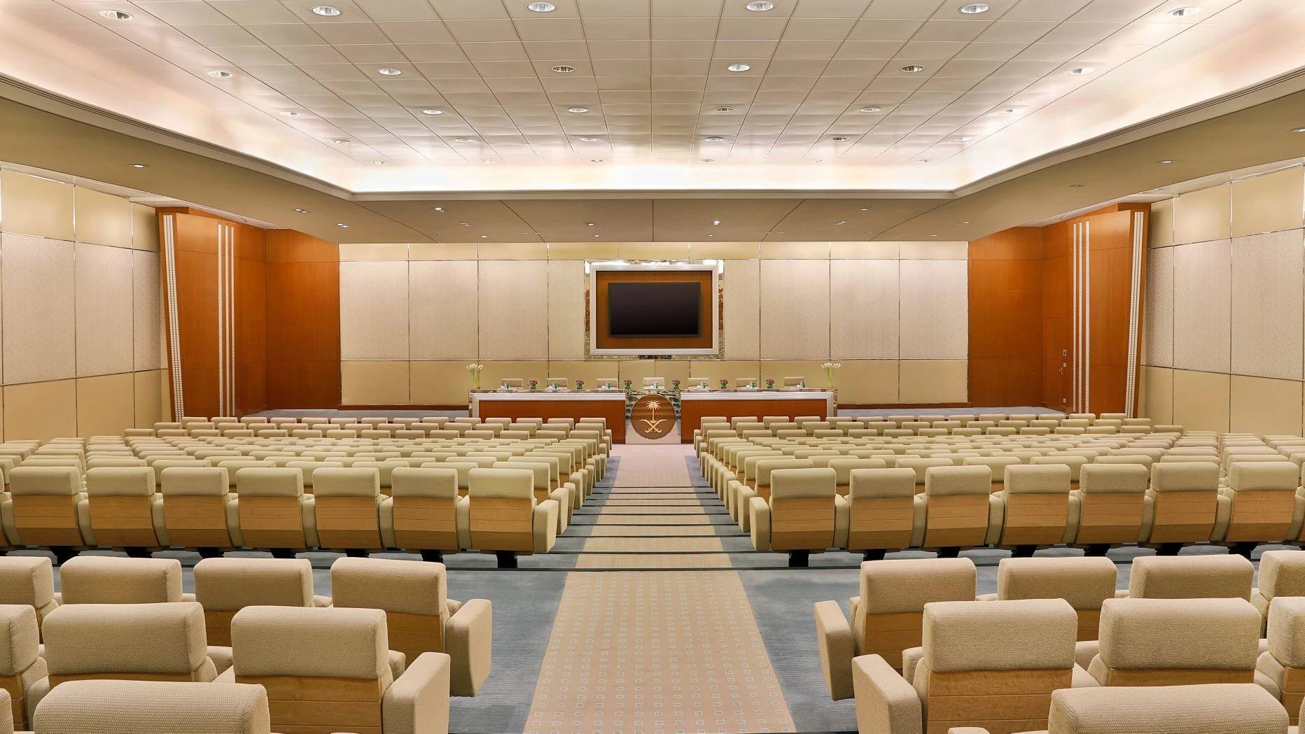 Spacious conference room at The Ritz Carlton Riyadh, beige seating arrangement.