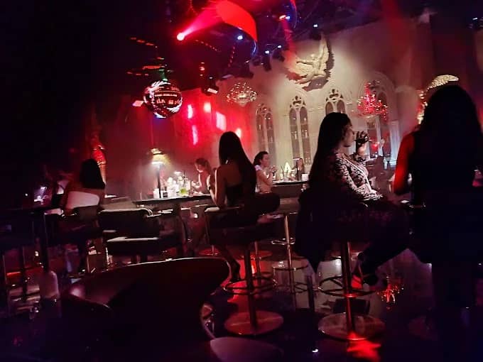 Dimly lit Vice Night Club in Downtown Dubai with patrons seated.
