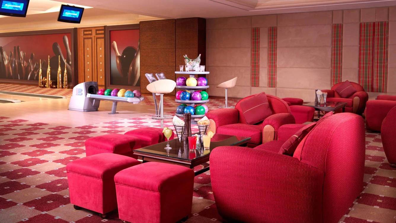 Luxurious bowling lounge at The Ritz Carlton Riyadh, vibrant seating area.