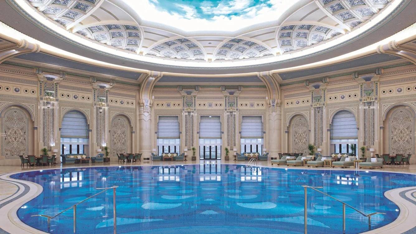 Ornate indoor pool with domed ceiling, The Ritz Carlton Riyadh.