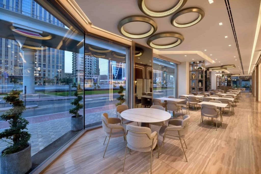 Modern interior of Al Safadi Restaurant DIFC, Dubai with large windows.