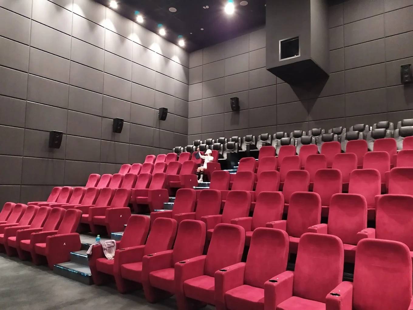 Empty red seats in Flik Cinema, Al Mirqab Mall, Doha.