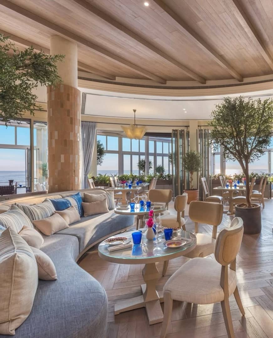 Elegant seating area in Yamaz Restaurant, Manama with sea view.