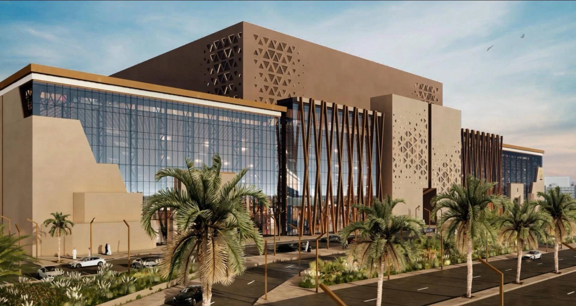 Modern Kingdom Arena Riyadh exterior with palm trees and geometric patterns.