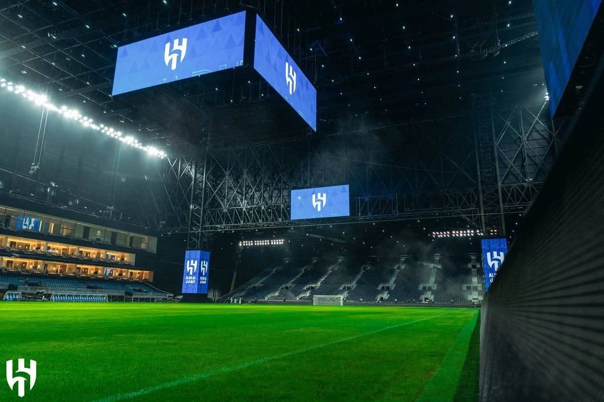 Kingdom Arena Riyadh interior with illuminated screens and seating.