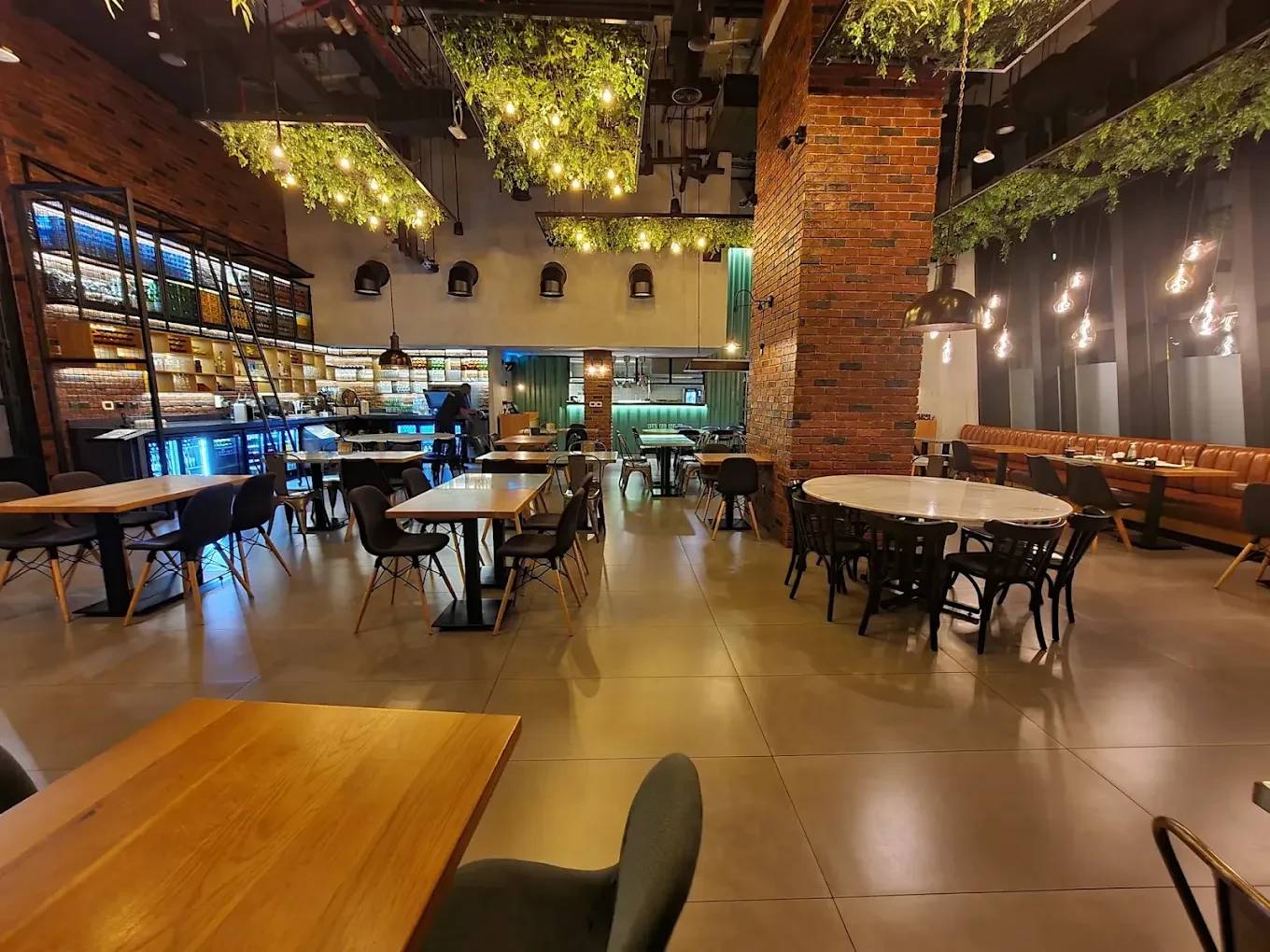 Swiss Butter Steak House interior with tables and hanging lights, Dubai.
