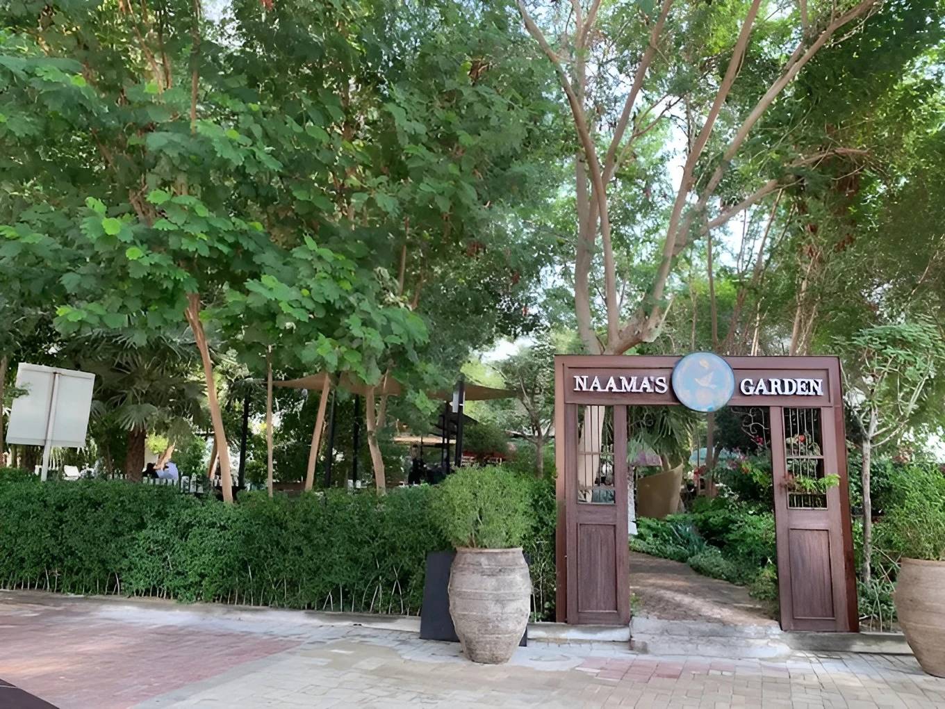 Entrance to Naama’s Garden, lush greenery, Doha venue.